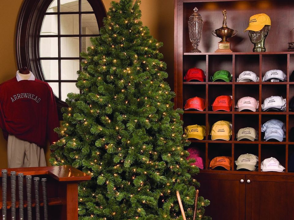 A tall decorated tree inside a shop