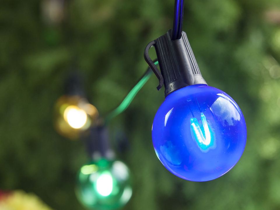 Blue, green and gold globe bulbs on a string
