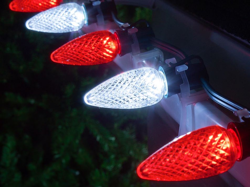 C9 bulbs alternating red and cool white along a gutter