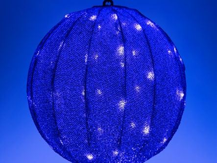 A light ball covered in shimmering blue mesh fabric